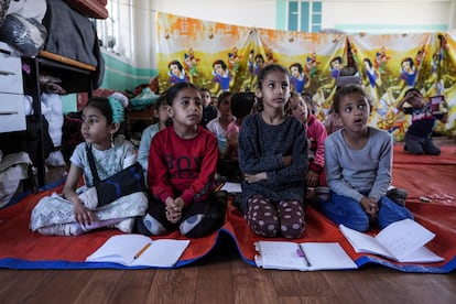 Children attend an activity at a makeshift class in Deir al Balah, on Sunday, April 21, 2024. Since the war erupted Oct 7, all schools in Gaza have closed, and nearly 90% of school buildings are damaged or destroyed, according to aid groups.