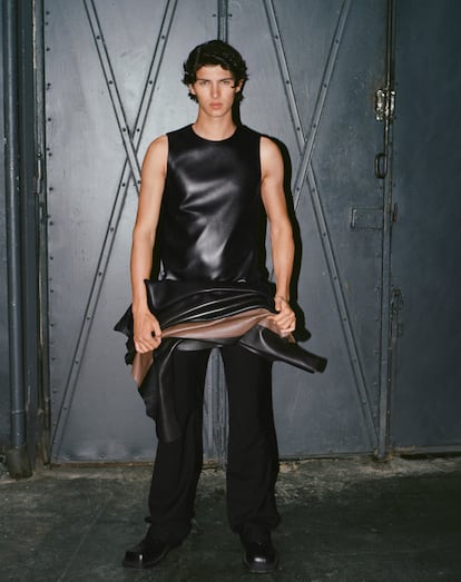 Model Nikolai of Monpezat, grandson of Queen Margrethe of Denmark, poses for ‘EL PAIS Weekly’ in this season’s men’s fashion trends. In this image, he wears a leather top and pants by Loewe and shoes by Bottega Veneta.
