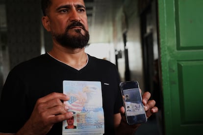 Mohamed Rabee displays U.S. passports belonging to him and his son, Amir Rabee. 