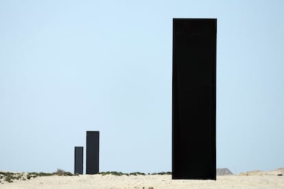 A view of three of the four gigantic monoliths by American artist Richard Serra, titled “East-West/West-East,” which stand in the desert of Zekreet, Qatar.