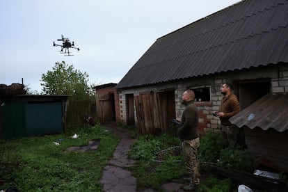 Members of the Ukrainian army's Achilles unit control the takeoff of a drone on May 14 that will amplify the signal of suicide drones used to attack Russian positions.